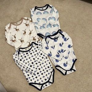 Four Monica and Andy bodysuits